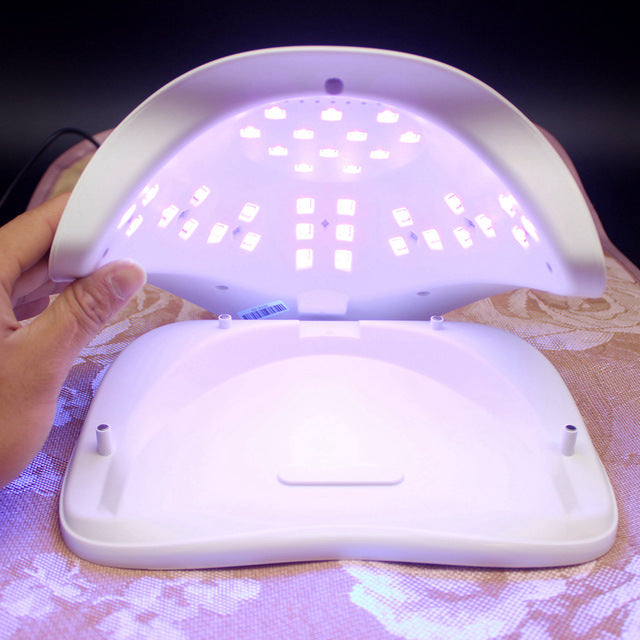 Nail dryer UV lamp showing power adapter included