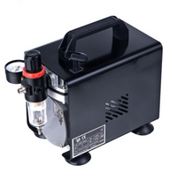 Thumbnail for Air brush compressor in use with airbrush tool