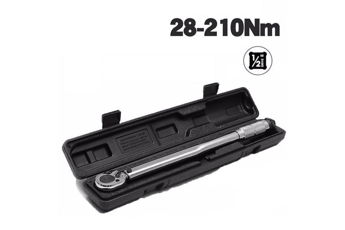 Torque wrench ratchet head with reversible lever