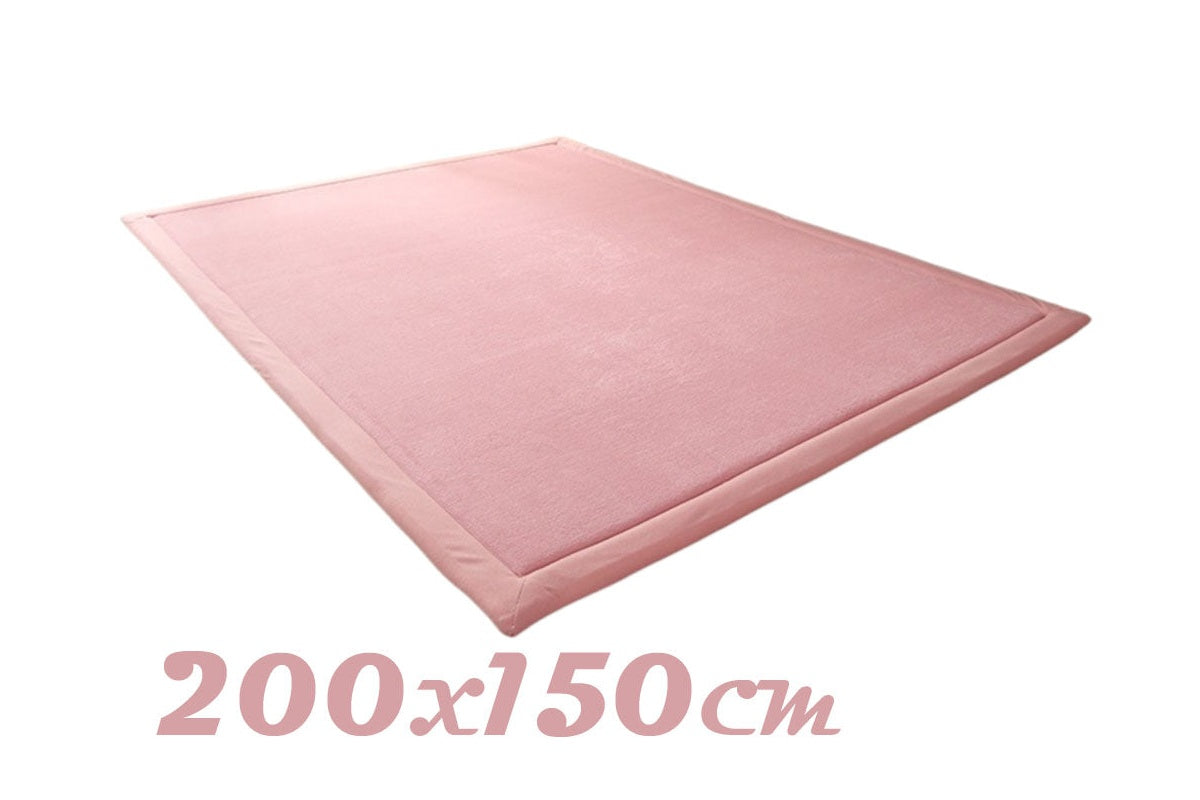 Large soft play mat on floor