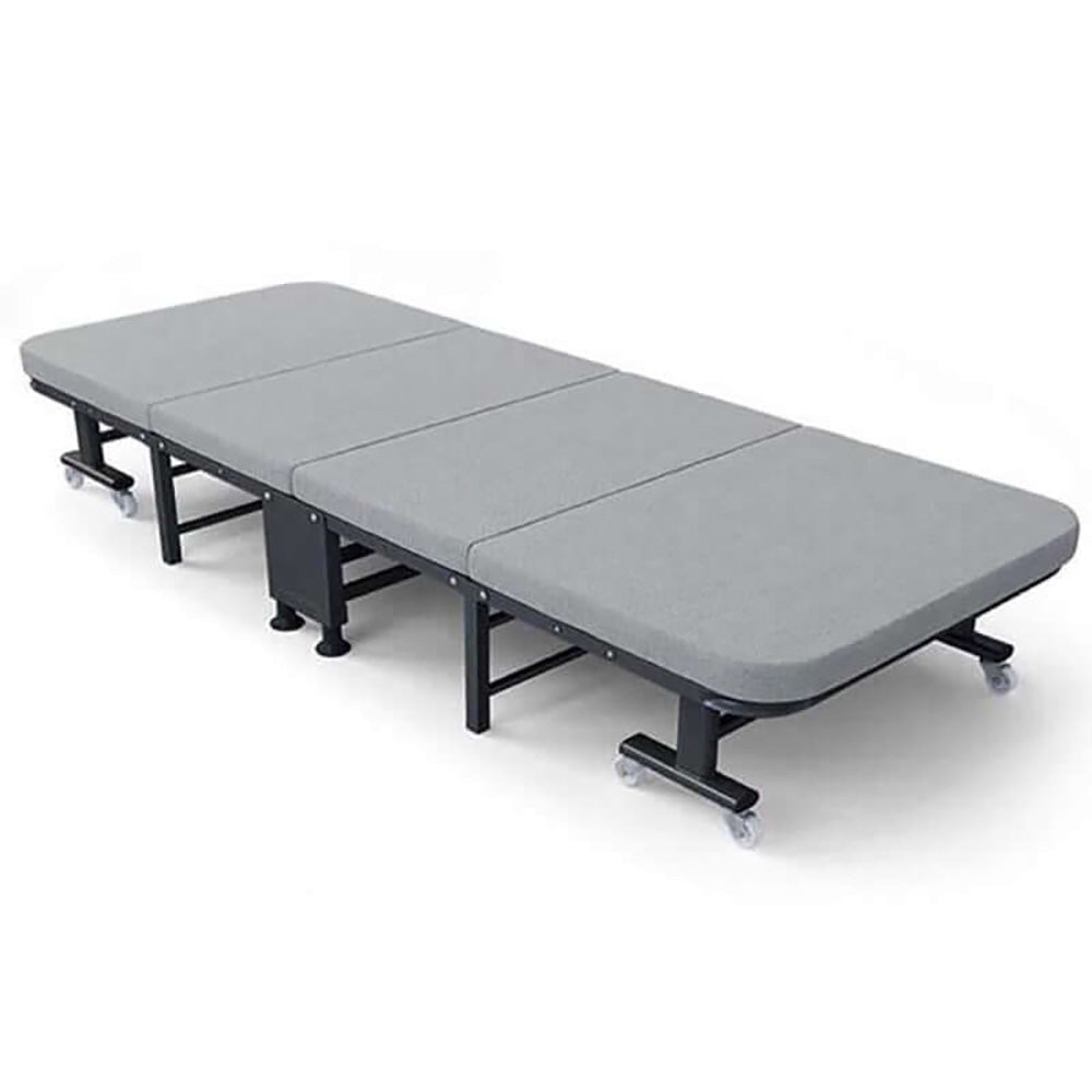 Foldable bed in guest room setting
