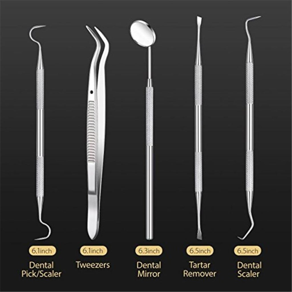 Dental tools arranged on white background