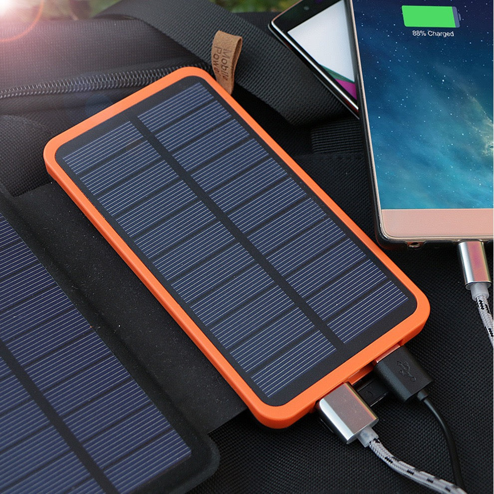 Solar power bank 20000mAh showing USB charging cables