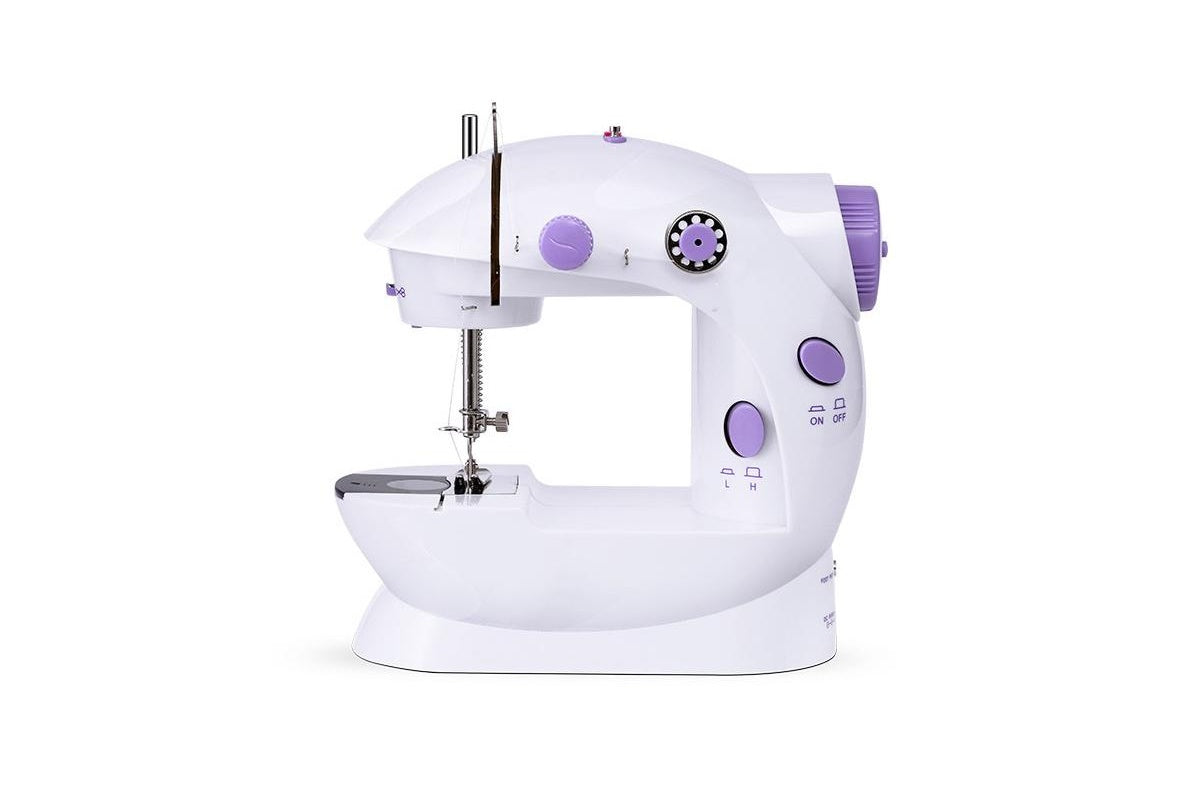 Close-up of mini sewing machine thread cutter and lamp