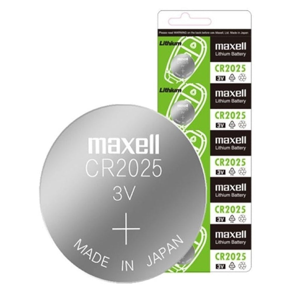 Maxell CR1632 battery next to calculator