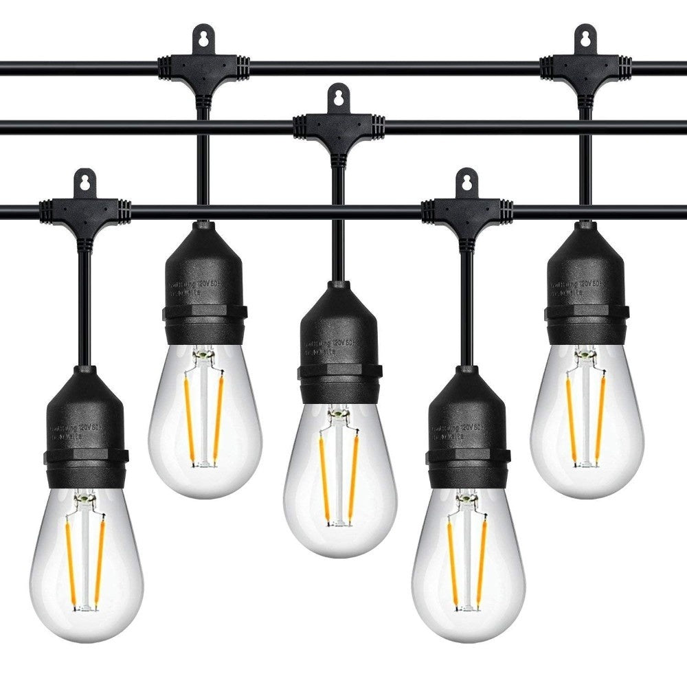 Festoon lights illuminating cafe outdoor seating