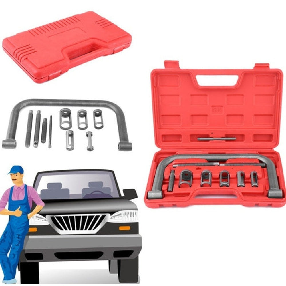 Valve spring compressor kit laid out on workbench
