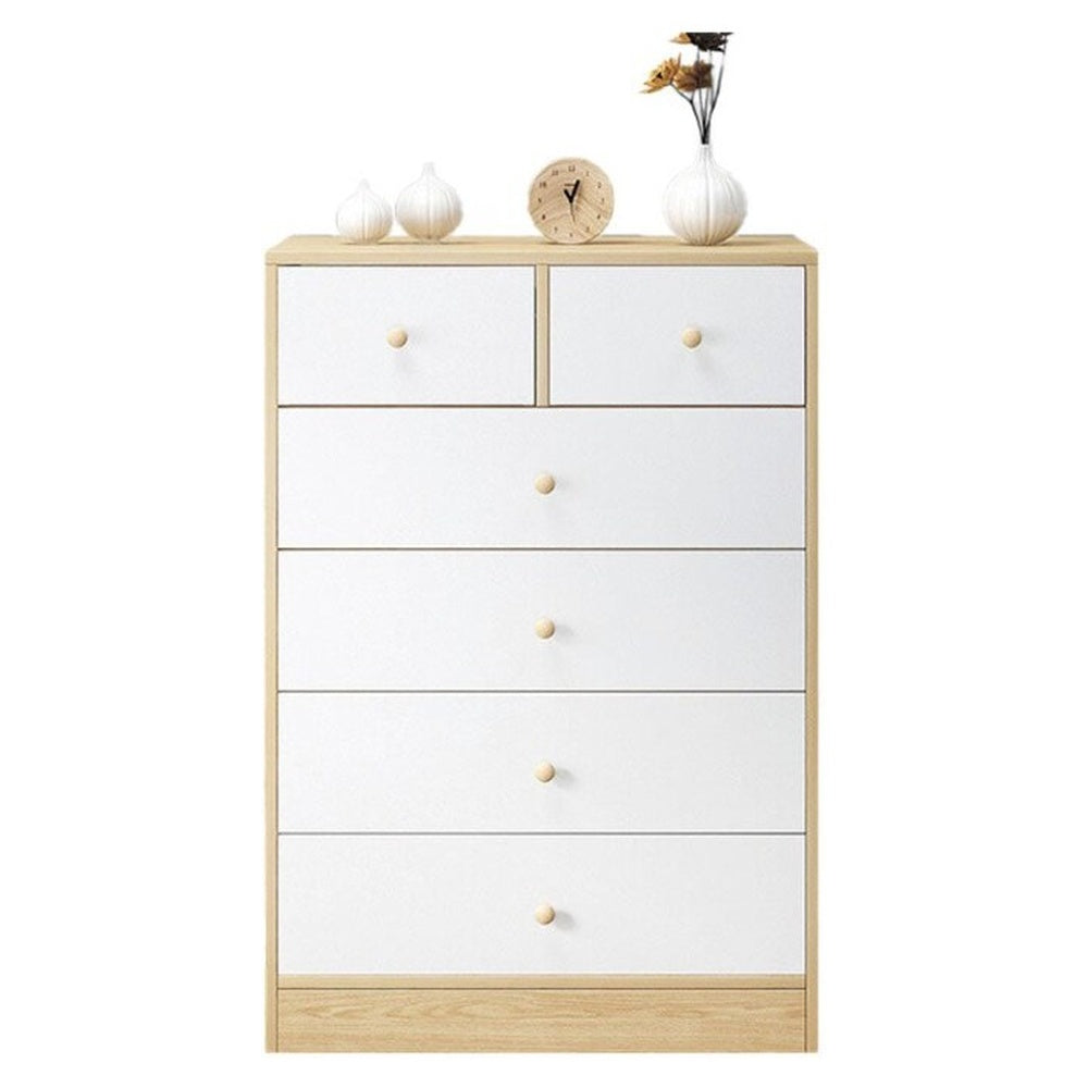 White tallboy dresser in bedroom setting