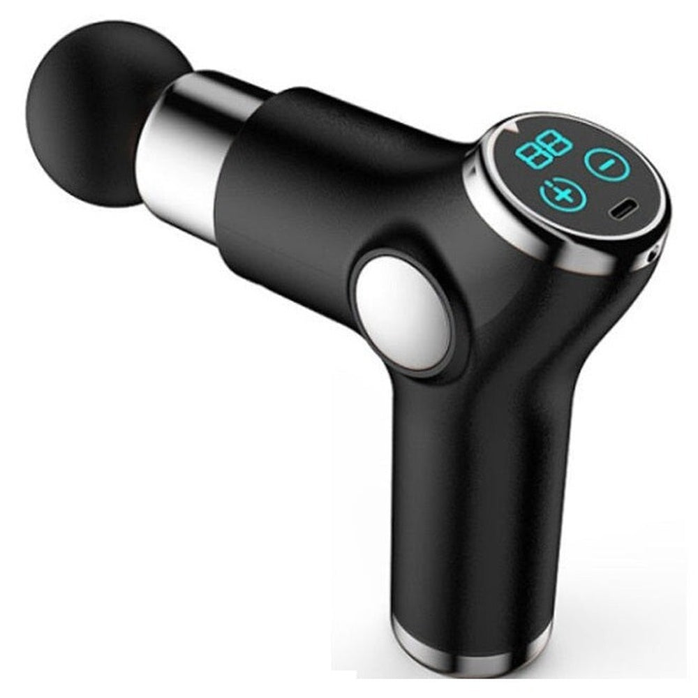 Black massage gun resting on table surface