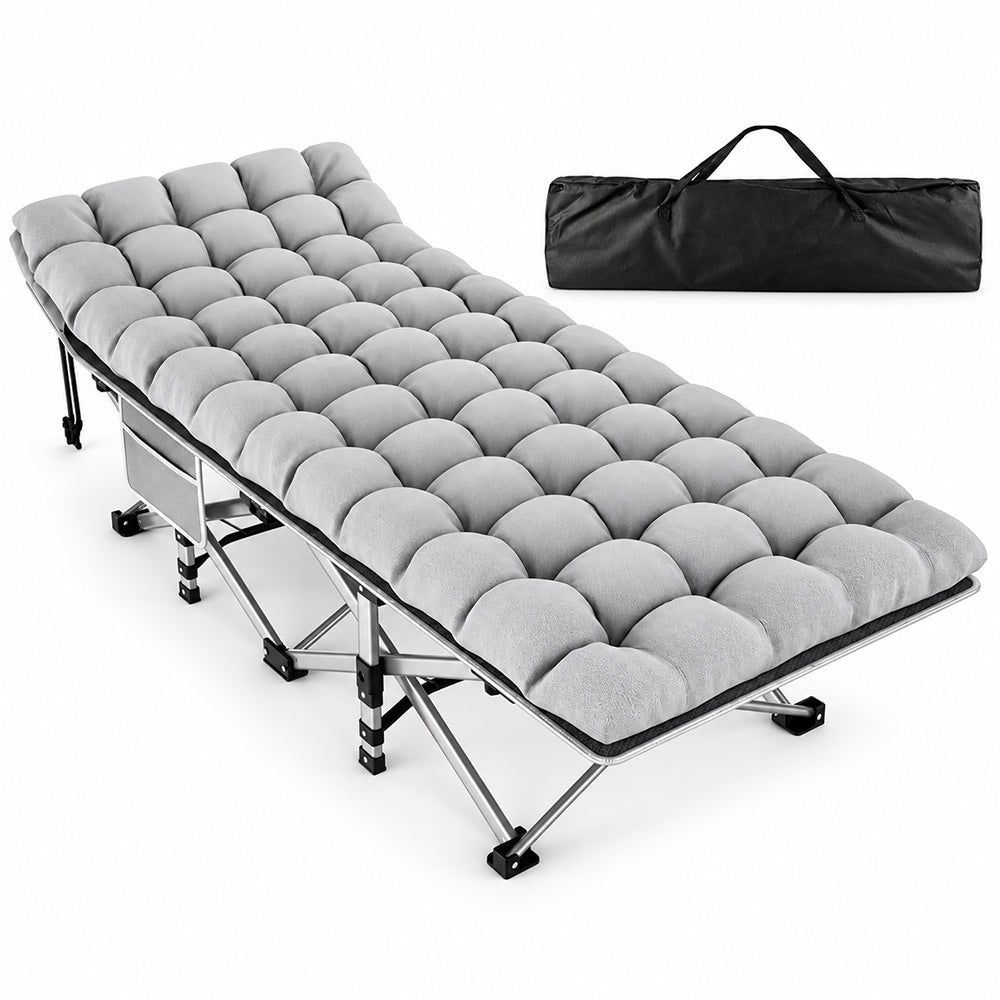 A light gray tufted camping sleeping pad laid out on a metal folding camp bed, with a black carrying bag shown in the upper right on a white studio background.