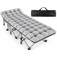 Thumbnail for A light gray tufted camping sleeping pad laid out on a metal folding camp bed, with a black carrying bag shown in the upper right on a white studio background.