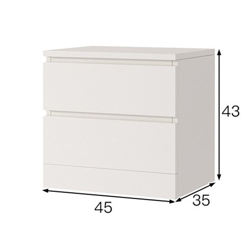 Bedside table placed beside bed in NZ home