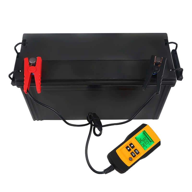 Battery tester with clamp grips