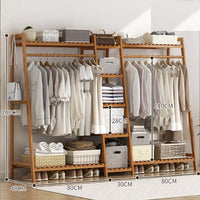 Thumbnail for Bamboo clothes rack holding coats and bags