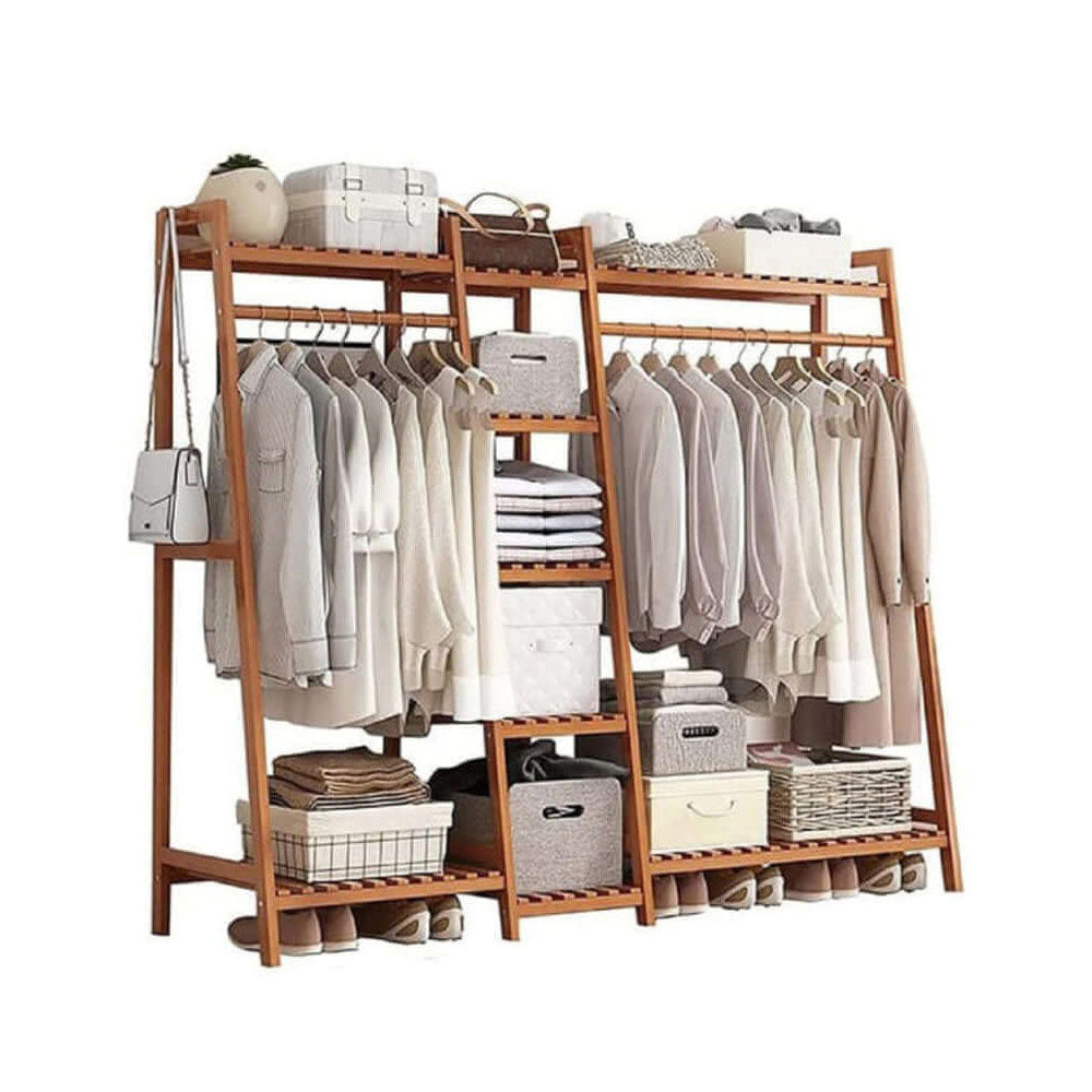Bamboo clothes rack holding coats and bags