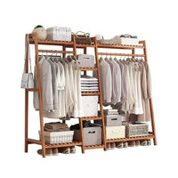 Thumbnail for Bamboo clothes rack holding coats and bags