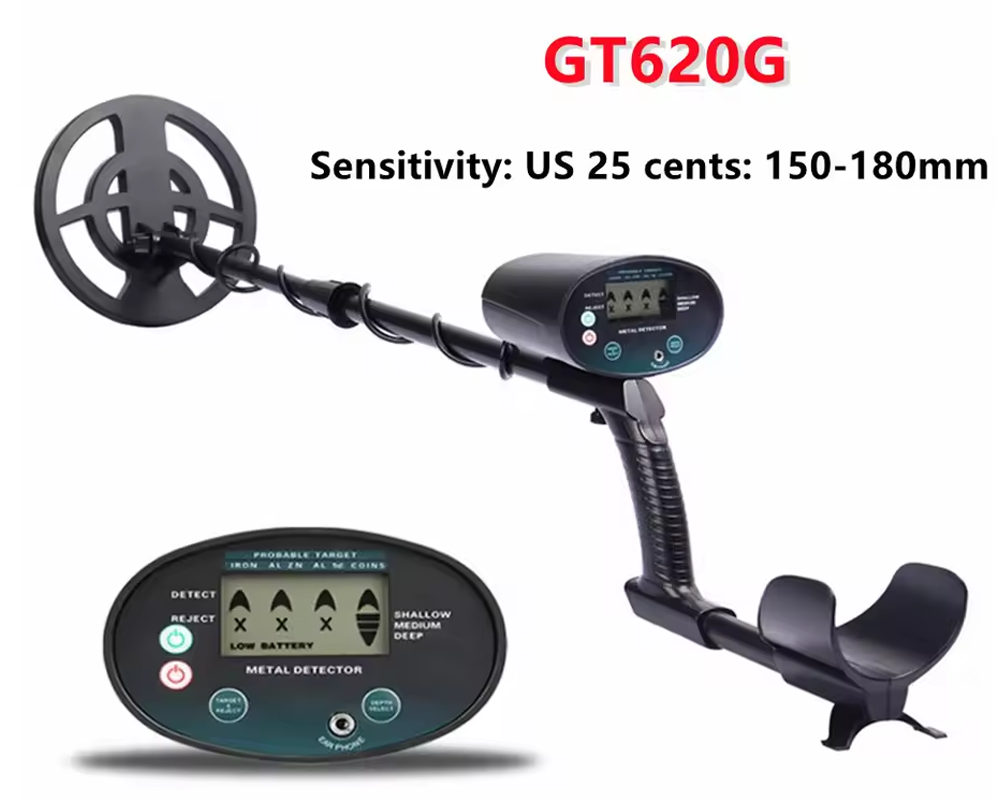 Metal detector in use on beach sand