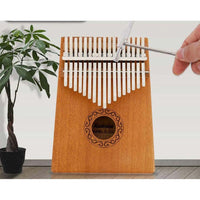 Thumbnail for Kalimba resting on wooden surface