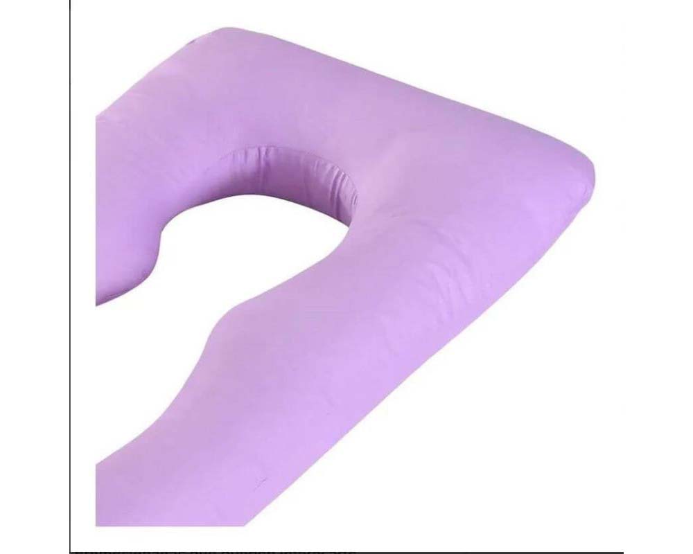 Full body pregnancy pillow on bed