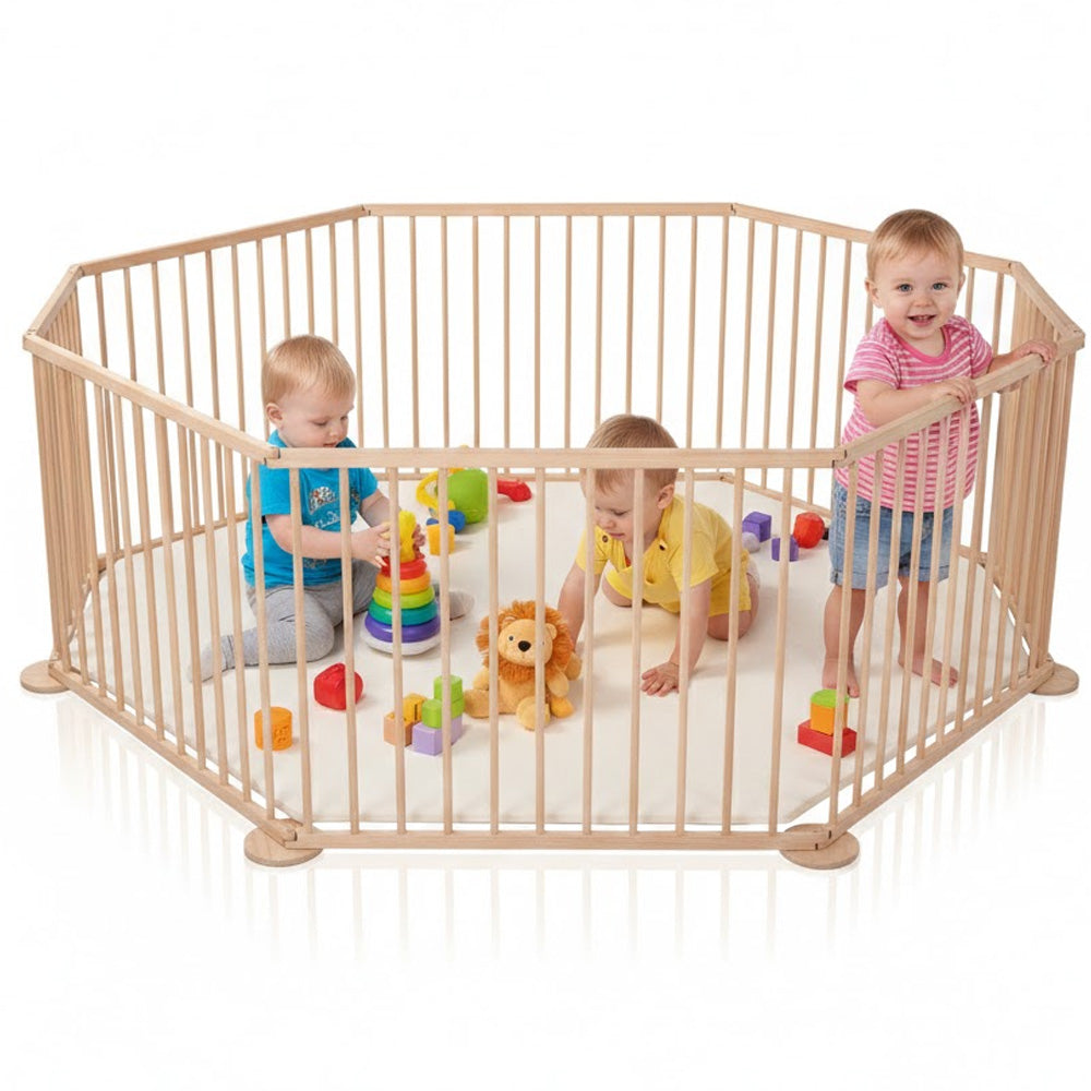Wooden play yard barrier in child playroom
