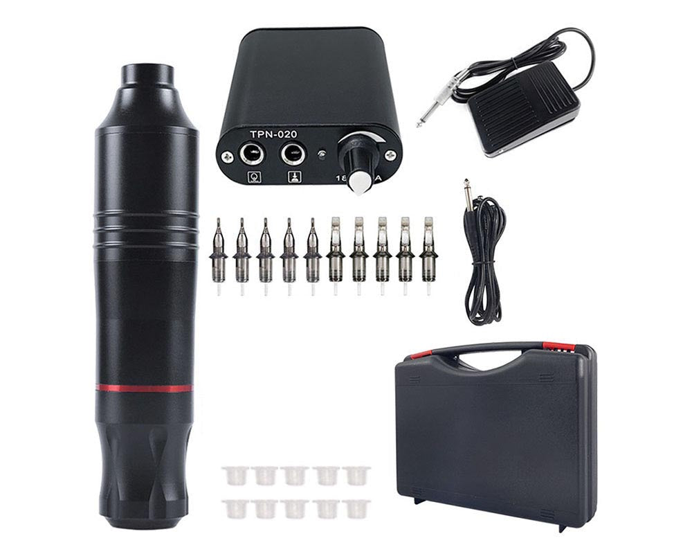 Tattoo kit components laid out including foot pedal