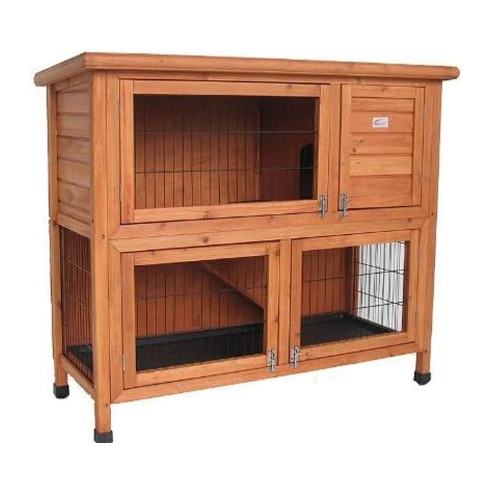 Rabbit hutch with rabbits inside in outdoor area