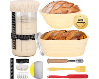 Thumbnail for Baking tools including a measuring cup, bowls, and utensils with bread on a white background.