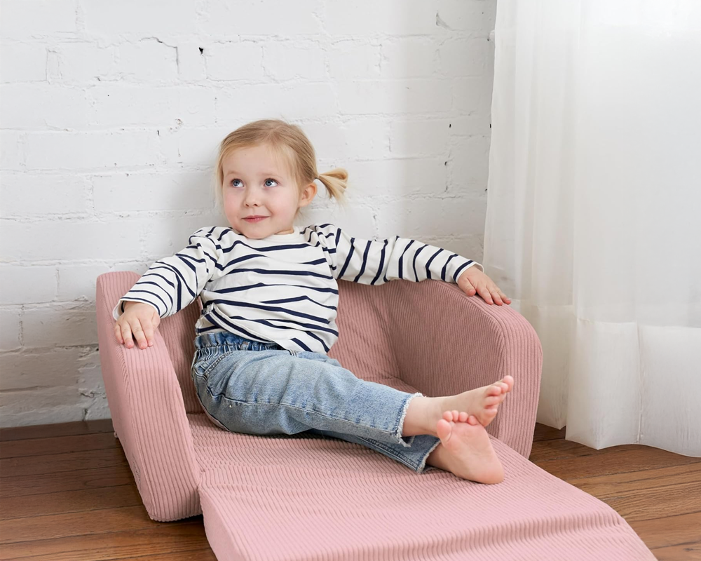 Pink toddler couch in bedroom setting