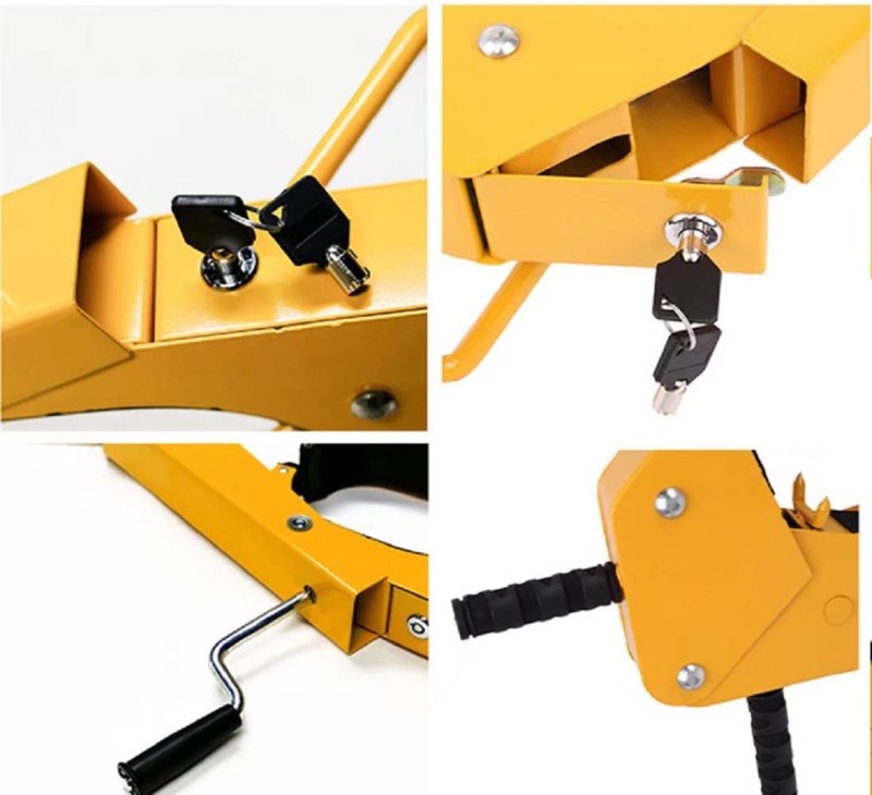 Wheel clamp with keys placed on wooden floor