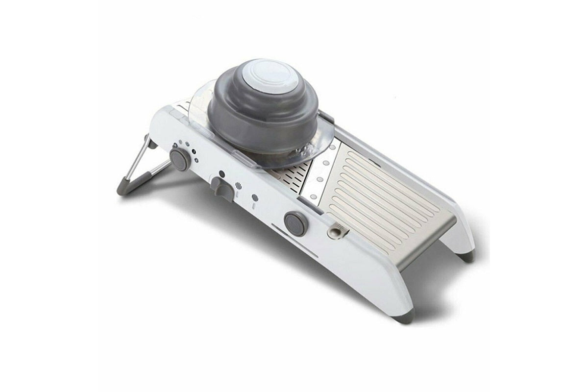 Mandoline slicer with safety hand guard